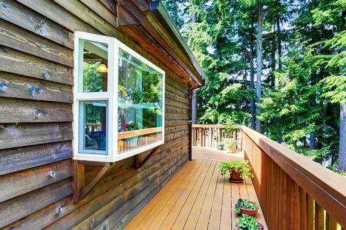 Cabin siding with white window protusion